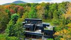 Welcome to Nature&rsquo;s Edge -- a Woodstock estate, where wilderness meets luxury. Perched at the end of a secluded private road, this modern mountain marvel offers unmatched privacy, serenity, and grandeur. Surrounded by natural woodscapes and native rock outcroppings, this 40 acre property sits adjacent to over 500 acres of forever wild NYC DEP land. The home itself, a Barry Price architectural masterpiece, will leave you questioning all you thought you knew about design. Featured in several publications, the details of this home include locally sourced and regionally crafted materials such as board formed concrete, epoxy coated structural steel, reclaimed black walnut, stainless steel, Onondaga limestone and lime based plaster walls all while maximizing the provision of thermal insulation and passive solar gain--comfort and energy efficiency. Within the 4600 square feet of living space, the home has 3 floors, each with its own bedroom and bathroom suite with custom cabinetry throughout. With an abundance of natural light, the timeless open-concept kitchen features a massive island, Wolf, Sub-Zero and Miele stainless steel appliances, oversized sink, espresso machine, and more. Step down into the sunken dining room with a wine refrigerator, ice machine, cold storage, and floating wood stove, surrounded by mountain views. On the lower level you will find the sprawling living spaces with continued details a plenty. Wood burning fireplace, wet bar, and sophisticated theatre room. The expansive doors and windows allow you to take in the undeveloped mountain sides natural features--a proper indoor/outdoor living experience. Continue to take in the scenery as you meander down the stone path to the breathtaking 52&rsquo; x 17&rsquo; vanishing edge pool, 8&rsquo; x 8&rsquo; vanishing edge spa, outdoor shower, and 224 square foot pool house. Equipped with the same finishes, the pool house offers an open area with massive sliding glass doors, full bathroom, refrigerator and freezer drawers, and mini split. Completely private, yet located just minutes from the heart of Woodstock. Enjoy all this vibrant community has to offer whether it&rsquo;s by way of the abundance of quality restaurants, shops, galleries, events, shows, and more. A short distance to many of the Hudson Valley&rsquo;s popular neighboring towns as well, Saugerties, Kingston, Phoenicia, Hunter, Windham, etc. while just over 2 hours to NYC.