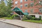 Located on a tree-lined street in downtown White Plains, the Parkville House combines charm and convenience. Just minutes to Starbucks, restaurants on Mamaroneck Avenue, shopping, and grocery stores. Less than a mile to the White Plains Metro North train station with express trains to Grand Central. Easy access to I287 and the Bronx River Parkway. Residents enjoy a secure building with bike storage, live-in super, on-site laundry on every floor, and security cameras. This 3rd floor apartment is appointed with crown molding, recessed lighting and parquet floors throughout. The open floor plan lends itself to entertaining with the kitchen open to the living space. The kitchen features granite counters and has a passthrough to the dining area. Relax in the primary bedroom with double closet storage. Enjoy a hall bathroom with granite counter, vanity, and glass enclosed shower. A truly move-in ready home in the heart of it all. 1 garage parking space upon closing. Some images are virtually staged