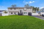 This wide-line high ranch has been expanded and was completed renovated within the last 4 years. Featuring a large amount of living space, 5 bedrooms and 2 full bathrooms. New doors, windows, floors, kitchen and a garage that is climate controlled. This home offers the possibility of income with the right permits.