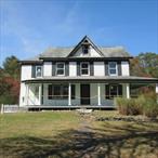 Situated on over 30 acres, this incredible property offers more than 2, 800 square feet of living space and endless potential for your personal touches. The home features a spacious and inviting floor plan with two bathrooms, an open kitchen with a center island, beautiful wood flooring, and a charming wrap-around front porchâ€”perfect for taking in the serene surroundings. A bonus detached barn is included. The second floor features four bedrooms, a full bathroom, and a walk-up attic space. Enjoy the breathtaking scenery, expansive yard, and the opportunity to hike and explore right on your own land. This is your chance to create a private paradise, blending comfort, nature, and endless possibilities. This is a HUD property and is being sold strictly AS-IS. Add your finishing touches to make this house your home. UI (Uninsured). FHA Financing 203(k) Eligible. FHA $100 Down Eligible. Please refer to HudHomeStore.gov for bidding information. HUD Case #371-556295.
