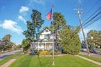 Gateway to Farmingdale Village, magnificent Victorian-style Colonial zoned R/O, Residence/Office, 2, 247 sq ft of living space. Property 21, 780 square feet, 1/2 Acre. Magnificent location in the heart of Farmingdale Village. Large new 6 car blacktop driveway with Belgium blocks, brick paver walkway, brick stoop and steps, elevator. Great curb appeal with newly painted shingle exterior, leaders and gutters, custom manicured landscaping. Storm door, entry steel door, eat-in kitchen with oak cabinets, Corian counters, ceramic tile backsplash and floor, stainless steel appliances, built-in microwave, pantry and hi hats, dining room with parquet floors, ductless split air conditioning, and double French doors to spacious living room with parquet floors, walk-out bay window and ductless air conditioning, den, office or bedroom with parquet hardwood floors. The main level features a large master bedroom with wall to wall carpet, ductless air conditioning, 2 closets, ADA compliant large full bath, with roll-in shower & wheelchair vanity, roll out vanity, ductless air conditioning, and ceramic tile. Main level laundry room with stackable washer and dryer. The second floor features a master bedroom with dressing area, built-in air conditioning and stained glass window, second bedroom with wall to wall carpeting, third bedroom with knotty pine woodwork, fourth bedroom with 2 closets, large full bath with ceramic tile, attic with scuttle. Basement, unfinished. All high ceilings, plaster walls, custom radiator covers, glass doorknobs. Oil heat, separate hot water heater, 275 gallon oil tank, new 200 amp electric, 2 car detached garage with attached barn with electric, walk-up attic, alarm system central station. Beautiful, oversized, park-like, manicured, privately fenced property. Brick walkway, brick patio, underground sprinklers. Convenient to all transportation, town, shopping and railroad.