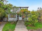 An affordable opportunity to own a slice of Paradise and make it your own. Escape to this charming original 4-bedroom, 1.5-bath cottage nestled in the serene village of Ocean Beach. Brimming with timeless character, the open and spacious first floor features vaulted ceilings throughout the kitchen, dining room & living room, ideal for relaxing and entertaining.  The Primary bedroom is conveniently located on the first floor with direct access to the back deck. In addition, the spacious enclosed front porch is perfect for unwinding with a good book and your morning coffee. Upstairs, youâ€™ll find three additional bedrooms and a convenient powder room, providing ample space for family and guests. Conveniently situated between the heart of town and the Beach, youâ€™ll have easy access to local shops, restaurants and the pristine shoreline. The property is on a full 50 x 84 lot and a fantastic opportunity for an investor or a homeowner eager to add their personal touch. Donâ€™t miss this opportunity to own a slice of paradise!