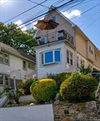 Discover this warm, beautifully maintained 3BD/1BA home located in the residential Kingsbridge Gardens community. Perched hillside with mature landscaping and treetop views, this inviting home features custom inlaid hardwood floors, a bright and airy sunroom and a private balcony off the primary bedroom perfect for relaxing mornings. Spacious backyard with patio offers a peaceful retreat ideal for entertaining. Attic and basement are not included in square footage. Centrally located with easy access to highways and public transportation. Low taxes make this property an excellent opportunity for homeownership. A must-see!