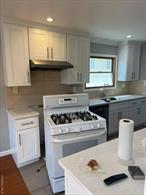 Newly Renovated Large 3 Bedrooms 2 Full Baths Apartment on the Second Floor, Large Living Room, Formal Dining Room, Hardwood Floor, Washer and Dryer are included, Central A/C, Excellent School District #26 (Ps 221, JHS 67 and Cardozo High School), and 2 Parking Spots. A Must See!