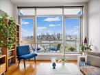 Welcome to Residence 13C at The East River Tower â€” a spacious one bedroom home spanning over 700 square feet with a private garage parking spot included, offering breathtaking city and river views from every room. This waterfront-facing residence features approximately 10-foot ceilings, beautiful hardwood floors throughout, and an open-concept layout perfect for modern living.The kitchen is a true showpiece, designed with leathered granite countertops, zebra wood custom cabinetry, stainless steel appliances, a vented hood over the stove, and a double-door refrigerator. Two custom-built closets with floor-to-ceiling shelving and oversized doors provide exceptional storage and style.The spacious bedroom enjoys the same panoramic city views, while the living room opens to a private balcony where you can relax and take in the skyline. The marble bathroom offers spa-like comfort with a deep jacuzzi tub â€” a perfect place to unwind after a long day. Additional highlights include central air conditioning and heating and an in-unit Asko washer/dryer for ultimate convenience.The East River Tower is a full-service, doorman building offering premium amenities, including a fitness center and a beautifully landscaped second-floor terrace with BBQ grills â€” ideal for entertaining.Ideally located near the NYC Ferry, this home combines luxury, convenience, and waterfront tranquility â€” all within minutes of Manhattan.*Common Charges: $736.91 + $145.61 parking*Current Assessment: $179.06