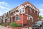 Move right into this classic brick corner property located in Woodhaven, Queens. The main level features hardwood floors throughout and a modern, desirable open kitchen and dining room layout. The living space is extended by a bright sunroom. This home is equipped for convenience, including a full basement with a dedicated washer and dryer area. The basement has a second entrance leading directly to the backyard and a side entrance to the home. A significant asset is the two-car detached garage, which provides secure parking and includes valuable attic storage above. Excellent natural light and a low-maintenance brick exterior complete this feature-rich home. Don&rsquo;t miss this opportunity.