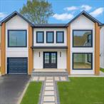 Brand-new construction BUILT BY AB DEVELOPMENT in the coveted MacArthur Schools district offering 5 spacious bedrooms and 4.5 designer bathrooms with a perfect blend of luxury and functionality. The open layout showcases a two-tone chefâ€™s kitchen with quartz backsplash, center island, and premium natural gas cooking, flowing into a dramatic double-height family room, formal living room, and dining room with custom wet bar. A main-level en-suite bedroom provides added convenience, while the luxurious primary suite features a walk-through closet and spa-like oversized bathroom. Additional highlights include efficient natural gas heating, designer finishes throughout, an attached garage, and a full unfinished basement offering endless possibilities for customization. Perfectly situated near shopping, dining, major highways, and award-winning schools, this home is a rare opportunity in Levittown.