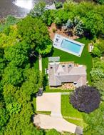 16 Walker Court, East Quogue, Luxury Waterfront Living Meets Modern Design!!! Welcome to 16 Walker Court, where modern elegance meets coastal tranquility. This waterfront masterpiece offers private access to Daveâ€™s Creek leading to Shinnecock Bay! Ideally located South of Montauk Highway, A true Hamptons gem that feels special from the moment you arrive!!! Step through the striking Pivot Door and discover a sun-filled, open-concept design by Sand Dollar Development, crafted for effortless entertaining and relaxed everyday living. Every detail has been thoughtfully curated, from the Cambria quartz waterfall countertops (with a lifetime warranty) to the top-of-the-line Viking appliances that elevate the gourmet kitchen. Enjoy peaceful views from the eat-in breakfast area, perfectly positioned to overlook the glass-enclosed, heated saltwater pool, ideal for watching summer afternoons unfold. This energy-efficient, green-built home offers sustainability without compromise, featuring high-performance windows, superior insulation, and advanced HVAC systems for year-round comfort and savings. The DaVinci fireplace adds a touch of warmth and luxury, creating a perfect balance of sophistication and coziness throughout the open living spaces. With three seamless walkouts to the backyard, this home was designed for the ultimate indoor-outdoor Hamptons lifestyle. Host summer barbecues by the pool, enjoy sunset dinners with breathtaking creek views, or unwind under the stars in your private sanctuary. The outdoor shower and direct waterfront access complete this resort-style retreat.