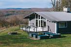 Once upon a time, this was Lodge #1 at Elko Lake Camp â€” the beating heart of a beloved Episcopalian retreat where campers gathered for meals, dances, and lifelong memories. Today, itâ€™s been reimagined as a 4 bedroom, 2 bathroom home that somehow still hums with that same intangible magic â€” a sense of joy and light that you canâ€™t quite describe, only feel.Set on a ridge just outside of Catskill Park, The Lodge offers single-floor living surrounded by sweeping nature in every direction. To the south: meadows catching golden light. To the west: mountain views that turn sunsets into daily events. And from the backyard, an extensive trail network begins â€” the same trails carved out by campers decades ago, now used for hiking, horseback riding, snowmobiling, mountain biking, or simply wandering. The adventure truly starts at your back door.Inside, the former â€œgreat hallâ€ is still the soul of the home â€” now transformed into a sprawling, light-filled gathering space that fits a 28-person dining table, a massive living area for fireside nights, and a built-in reading and record nook designed for lingering. The kitchen is generous and social, easily fitting three cooks in motion, complete with a Viking range, pot filler, and plenty of prep space. Two smaller bedrooms offer meadow and mountain views, while the primary suite includes a walk-in closet worthy of envy. A large, spa-like bathroom off the primary provides a steam room shower and double vanity. A larger, tucked-away bedroom in back offers quiet retreat when the day winds down.Outside, the two-story detached garage with electric is as functional as it is full of potential â€” three bays in front, one in back, nearly 1, 200 sq ft on the ground floor, and an additional 680 sq ft above for studio, storage, or future expansion. The Elko Lake Property Owners Association provides private access to Elko Lake (non-motorboat), along with a shared dock, park, pavilion, and a court for tennis, pickleball, and basketball â€” plus year-round road maintenance, all for a low annual fee.And while The Lodge feels utterly removed, Livingston Manor is only ten minutes away â€” a perfect blend of wilderness and small-town charm. Spend the morning exploring the Willowemoc Wild Forest or fishing the famed rivers, then head into town for coffee at The Walk-In, provisions from Main Street Farm, a pint at Catskill Brewery, or dinner at The DeBruce or The Kaatskeller.The Lodge is that rare place where nostalgia meets now â€” where every breeze feels like a memory, and the joy and laughter of summers past are quietly woven into the walls.