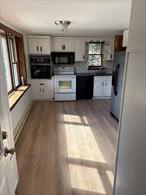 Spacious two bedroom home with a large eat-in-kitchen. Bright bedrooms with many windows and a balcony.