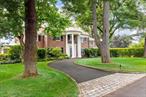 TIMELESS ELEGANCE MEETS MODERN LUXURY in this Magical 1927 property situated on nearly a full acre in sought-after Gedney Farms. This exceptional 5-bedroom, 4.5-bath home offers many luxury amenities, including a sauna, jacuzzi, and stunning pool surrounded by manicured gardens, specimen trees, brick paths, and stone fountains. The grand facade showcases four majestic two-story white columns against a brick facade. Inside, spacious light-filled rooms balance grandeur with intimate comfort. The spectacular 1993 addition (featured in Remodeling Magazine at the time) adds a wow factor with its dramatic two-story library with a cupola open below to an Arts and Crafts-inspired Family Room, complete with wooden built-ins, interior columns, and a corner gas fireplace that also faces the kitchen. Hand-selected Portuguese tiles add European sophistication to the large skylit kitchen, enhanced by a charming circular breakfast nook, creating an inviting space for morning coffee or casual dining. The architectural uniqueness of this home again reveals itself in the extraordinary circular primary suiteâ€”a truly one-of-a-kind design - with private access to the pack yard. The luxurious Primary Bath features a rejuvenating sauna and jacuzzi tub, transforming daily routines into spa-like experiences. Ample closets throughout ensure ample storage. The lower level of the home also includes a tiled entry foyer with French doors, a formal Dining Room with hidden pocket walls, a light-filled office with a gas fireplace, and spacious living room with gas fireplace. Traveling up the center stairwell, enjoy a stunning view of the backyard from a set of stately landing windows. Upstairs features four additional bedrooms with generous closets and abundant natural light, a reading room, and the dynamic library (book-lovers&rsquo; hearts might skip a beat upon entry!) showcases four walls of floor-to-ceiling bookshelves rendered in warm wood tones, topped by a cupola --- all open below to the Family Room. The meticulously maintained grounds have evolved over decades of love and care, featuring stone patios, fountains, sculptures, wooden Monet-Style bridges, and brick walkways. The pool house, attached to the garage, has a kitchenette, two changing rooms, and a half bath - - - Plus an outdoor heated shower with plenty of privacy. Enjoy ample parking with a three-car garage, and additional parking spaces in front of the garage and within the front circular driveway. The GEDNEY FARMS NEIGHBORHOOD is quiet and serene with tree-lined streets and a country atmosphere, yet this home is just minutes from downtown White Plains, award-winning schools, Westchester Hills Golf Club, upscale shopping, and fine dining. Metro-North express service reaches Manhattan in 45 minutes, and the new owners will find major highways within close proximity. With recent upgrades, including interior/exterior painting, new pool house sliding door, and new HVAC system (2025), this spectacular home is MOVE IN READY for the next owner, just bring your furniture and lounging robe! Additional home features include a full-house backup generator, security system, hard-wired smoke detectors, grounds sprinkler system, and original solid wood floors and ceramic tiles throughout. With its rare combination of historic charm, modern comfort, and premier setting, this residence is more than a homeâ€”itâ€™s a piece of Gedney Farms history. Let your next chapter begin at 9 Oxford Road! ***HIGHEST, BEST, AND FINAL DUE BY WEDNESDAY, NOVEMBER 19th AT 3 PM*** 11/20/25: A/O