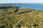 .38-acre wooded level lot in a private and natural setting. Ideally located near Paradise Point, Cedar Beach, Southold shops, vineyards, farmstands and Greenport Brewery. This is a triangle shape lot with 258ft of frontage on N Bayview Rd and 178ft/182ft deep on each side. A rare opportunity to create your own coastal retreat in one of the North Forkâ€™s most desirable neighborhoods. No preliminary work has been done with the DOH, Planning Board, or building dept at this time. Please don&rsquo;t walk property without your agent present.