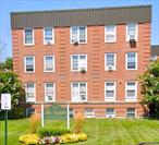 Welcome to The Majestic Building, a beautifully maintained co-op residence offering elegance, comfort, and convenience in the heart of Lawrence. This spacious unit features gleaming hardwood floors that flow seamlessly through the living room and dining area, creating a warm and inviting space perfect for relaxing or entertaining. The 2 bedrooms boast classic parquet floors and ceiling fans, providing both charm and comfort. The modern kitchen is outfitted with granite countertops, stainless steel appliances, ceramic tile flooring,  ideal for any home chef. Recessed lighting (high hats) throughout adds a contemporary touch and highlights the apartmentâ€™s clean, open layout. Located in a well-maintained elevator building with close proximity to shops, transportation, and houses of worship, this unit combines style and convenience in one of Lawrenceâ€™s most desirable addresses.