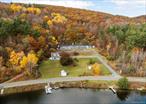 Fall in love with this Queechy Lake opportunity - where the lake itself is considered one of the most pristine lakes in New York state! An amazing lakefront property where the views continue far beyond the distant shores. With a combined total land area of just over 9 acres; spanning two parcels and with over 100&rsquo; of private shoreline, the possibilities seem endless. The original motel and use date back to 1965 and with one&rsquo;s creative vision and renovation, new life can be realized in welcoming vacationing guests back again. The twenty room motel building also includes a kitchen, restaurant, owner/manager apartment, office and partial basement mechanical room. Unobstructed views of the lake and long-distance eastern morning sunrises can be had from each motel room. The adjoining 7-acre wooded hillside provides for privacy on the backside where guest hiking trails can allow even more impressive lake views. Experience Queechy Lake Motel year-round through summer lake activities, hikes in state parks or local skiing at Jiminy Peak and Catamount - all a short drive away. The setting is tranquil while close to attractions including Tanglewood, The Shaker Museum and Village, Norman Rockwell Homestead. Dining awaits in the towns of Chatham, Hudson, Lenox and Stockbridge. A unique opportunity to be considered, before it&rsquo;s gone!!