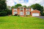 Spacious and Bright Center Hall Colonial in desirable Lakeville Estates. This East Hills home has been lovingly maintained by its original owner, offering 5 bedrooms, 3.5 baths, and a traditional yet open floor-plan. The main level features a sun-filled entry foyer leading into the living room, formal dining room, eat-in kitchen, and cozy den with wood burning fireplace and sliding doors to the backyard. A powder room, bonus bedroom, full bathroom and laundry complete the first floor. Upstairs includes the large primary en-suite, three bedrooms (currently 2, plus office) and a hall bath. Additional highlights: a full lower level ready for customization, new roof (2024), new heat pump, Electric HVAC, 2 car garage. Membership to the East Hills Park and Roslyn School District. A wonderful opportunity to make this home your own.