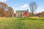 Experience the perfect blend of historic charm and modern refinement with this circa 1790 Colonial Farmhouse, thoughtfully rebuilt with meticulous attention to detail and authenticity. Set on 51 private and picturesque acres, this property embodies the true essence of Hudson Valley living peace, privacy, and panoramic natural beauty.The main home welcomes you with a warm and inviting layout designed for effortless entertaining. Featuring a spacious living room, elegant dining room, a convenient half bath, and a beautiful kitchen with timeless farmhouse style. Upstairs, youâ€™ll find three comfortable bedrooms and two well-appointed bathrooms, providing the perfect retreat after a day spent exploring your expansive grounds.Step outside and take in the breathtaking surroundings, 51 acres of open fields, wooded trails, and serene vistas, complemented by a sparkling in-ground pool with a poolside bar and cabana. Whether hosting unforgettable summer gatherings or unwinding quietly in the sun, this outdoor space offers the ideal balance of leisure and seclusion.The restored 1890 barn, offering an impressive 5, 436 sq. ft., is an exceptional extension of this estate. The main level provides a heated studio/workshop space with radiant floors and wood heat perfect for creative pursuits or large-scale projects. The fully renovated upper level features a 3-bedroom, 1.5-bath apartment complete with a private deck overlooking peaceful pastoral views. Ideal for multi-generational living, guest quarters, or income-producing rental opportunities.Here, nature and convenience meet. Enjoy miles of scenic tranquility, while being just 20 minutes from New Paltz and only 15 minutes from the world-renowned Mohonk Preserve and Minnewaska State Park.This is more than a home itâ€™s a rare Hudson Valley estate offering history, versatility, and unmatched countryside living.