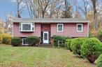 Move-In Ready Hi-Ranch in Prime Location! Welcome to this beautifully updated Hi-Ranch in one of New Cityâ€™s most sought-after neighborhoodsâ€”just a short walk to town, shops, and restaurants, and located within the highly regarded Clarkstown School District (Clarkstown South High School and Laurel Plains Elementary). This move-in-ready home offers 4â€“5 bedrooms and two brand-new full bathrooms, providing flexibility for todayâ€™s lifestyle. Step inside to freshly painted interiors and gleaming hardwood floors, newly sanded and stained in a rich dark finish. The renovated kitchen features Corian countertops, new appliances, and new flooring, with a convenient walk-out to the deckâ€”perfect for outdoor dining or morning coffee. Upstairs includes three comfortable bedrooms and a stunning new full bath. The lower level features a spacious family room with a brick fireplace, a bedroom, and an additional room ideal for guests or home office. This level walks out to a flat, mostly fenced backyardâ€”great for play or entertaining. Additional highlights include a one-car garage, new central air, young roof and gutters, newer windows (all replaced except the living-room bay window), two-zone hot-water baseboard heat, new ceiling fans and light fixtures, and a 2021 furnace. Separate laundry room adds convenience. Located in the Town of Clarkstown, residents enjoy access to three beautiful community pools for a nominal seasonal fee, along with town parks, recreation programs, and a vibrant downtown New City atmosphere. A true New City gemâ€”beautifully maintained, thoughtfully updated, and ideally located near schools, shopping, and transportation.