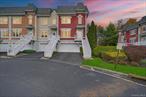 Accepted Offer - Showing for backup. Nestled in a highly desirable gated community of Versailles of Nanuet, this stunning corner unit townhouse offers over 2, 500 sqft of living, offering more space than most nearby single family homes without any of the maintenance. The perfect blend of modern convenience and serene suburban living, just moments away from major highways, lush parks, and premier shopping centers. Recently refreshed with a modern cosmetic renovation, the home boasts an updated kitchen featuring top-of-the-line appliances including a sleek refrigerator, oven, dishwasher, microwave, and stove, complemented by a stylish newly installed backsplash. Energy efficiency shines through with new light fixtures equipped with LED bulbs throughout, Nest wireless thermostats for smart climate control, and a water softener system for optimal comfort. The garage is equipped for the future with an EV charger outlet and a WiFi-enabled wireless door opener, while practical upgrades like a brand new washer, dryer, and water heater ensure seamless daily living. The expansive floor plan includes a bonus office with stair carpet tastefully updated, 3 bedrooms and 3.5 bath equipped with wifi wireless light switches. All the bathrooms impress with modernized toilets, shower heads, and faucets, making this move-in-ready gem an ideal choice for discerning buyers seeking luxury and low-maintenance elegance. Outdoors you will find meticulously maintained grounds with resort style pool and clubhouse for enjoyment in the summer months.