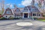 Introducing Luxury & TRANQUILITY at its finestâ€“ The Modern Classic Estate, Revitalized in 2024, this 5 bedroom 7.5 bathroom  Colonial sits behind a gated entry on 2.06 beautifully landscaped acres in prestigious Old Westbury, with highly desired Jericho School District. A brand-new (2025) cedar shingle roof complements the stone-and-shingle exterior, creating spectacular curb appeal.The grand foyer with 17-ft ceilings leads to sun-filled interiors featuring light oak floors, custom millwork, and soaring vaulted ceilings. The double-height living room with fireplace opens to expansive bluestone terraces. A formal dining room connects to an elegant butlerâ€™s pantry with wine cooler and ice maker.The chefâ€™s kitchen showcases custom cabinetry, Calacatta marble countertops, top of the line appliances, massive center island, transitioning into a vaulted family room with wood-burning fireplace and French doors. The west wing primary suite includes custom dressing rooms, dual custom-style baths with rainfall showers, soaking tub, and heated floors, plus garden access.Four en-suite bedrooms and a laundry room complete the second floor with space to create a 5th bedroom. The lower level offers a media room, gym, recreation areas, full bath, and walk-out access.Resort-style grounds feature rolling lawns, perennial gardens, and a recently marble-dusted heated gunite pool. Additional amenities include a 3-car heated garage, landscape lighting, advanced security system, central vacuum, irrigation system, and whole-house generator.Amazing Location just 25 miles from NYC; this estate offers the perfect fusion of luxury, privacy, and convenience.