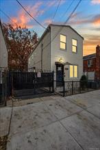 Property being sold as-is. Home is currently classified by the building department as a single-family dwelling, although paperwork to convert it to a legal two-family was initiated in 2012 and received initial approval. However, the process was never fully completed. Buyer to perform their own due diligence with the municipality regarding CO status and any potential future approvals. The first floor features a one bedroom, one bathroom layout, and the second floor also offers a one bedroom, one bathroom unit. In addition, the finished basement includes a bedroom and a bathroom with a walk out to the backyard and access from the first floor, giving you even more usable space.This home has been occupied by the owners for many years and has been maintained with care. It includes a newer hot water heater, an updated circuit breaker panel, a fast charger in the driveway for electric vehicles, and a fully gated property with a large driveway and a spacious backyard.The property will be delivered vacant, making it easy for a new owner to move in or set up as needed. Located about half a mile from the train station, this home offers convenience and solid value in Ozone Park.