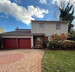 Colonial Loverâ€™s! Well - maintained and charming 4-bedroom, 2.5-bath home in Hempstead located near Hofstra University and within the Uniondale School District.Enter into a grand foyer leading to a sun-filled living room and an adjoining formal dining room with sliding doors to the deck and backyard perfect for outdoor relaxing.The eat -in kitchen offers plenty of cabinetry.One step down brings you to a comfortable sized den and a half bath with access to the backyard and an attached 2-car garage.Upstairs features a spacious landing with 4 bedrooms plenty of closet space and attic access.Great basement with open space and high ceilings.